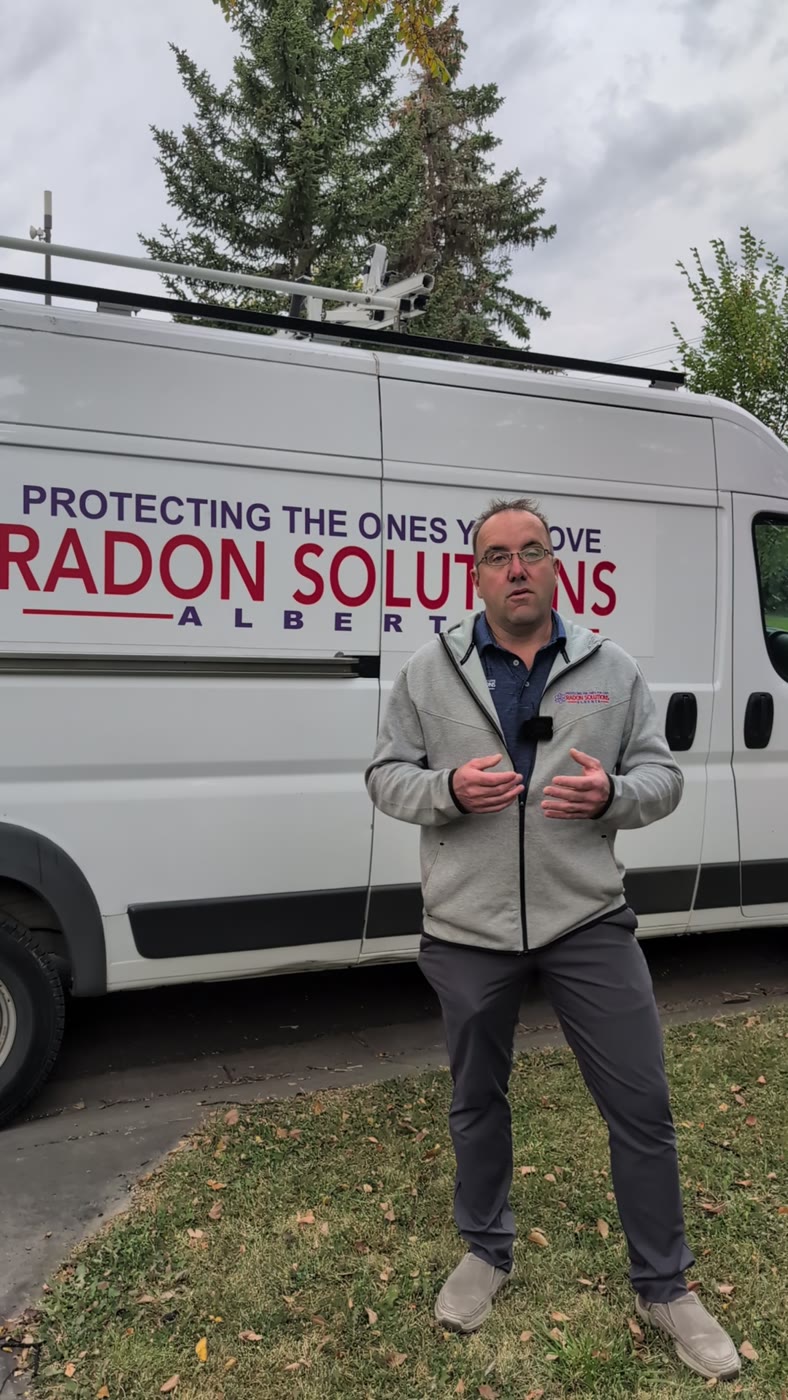 Howard Fuhr, owner of Radon Solutions Alberta, standing in front of the company van.