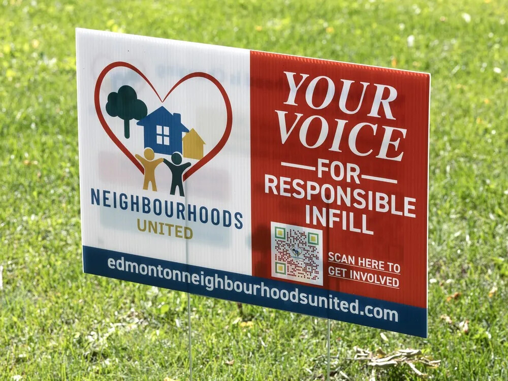 An Edmonton Neighbourhoods United lawn sign: a heart around a house, trees and a family, beside Your voice for responsible infill and a QR code.