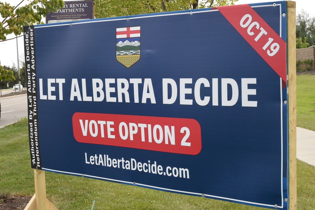 A Let Alberta Decide sign: Alberta coat of arms, Let Alberta Decide, Vote Option 2, Oct 19, authorized by Let Alberta Decide, referendum third party advertiser.